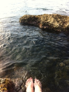 My feet, dangling in the Mediterranean Sea
